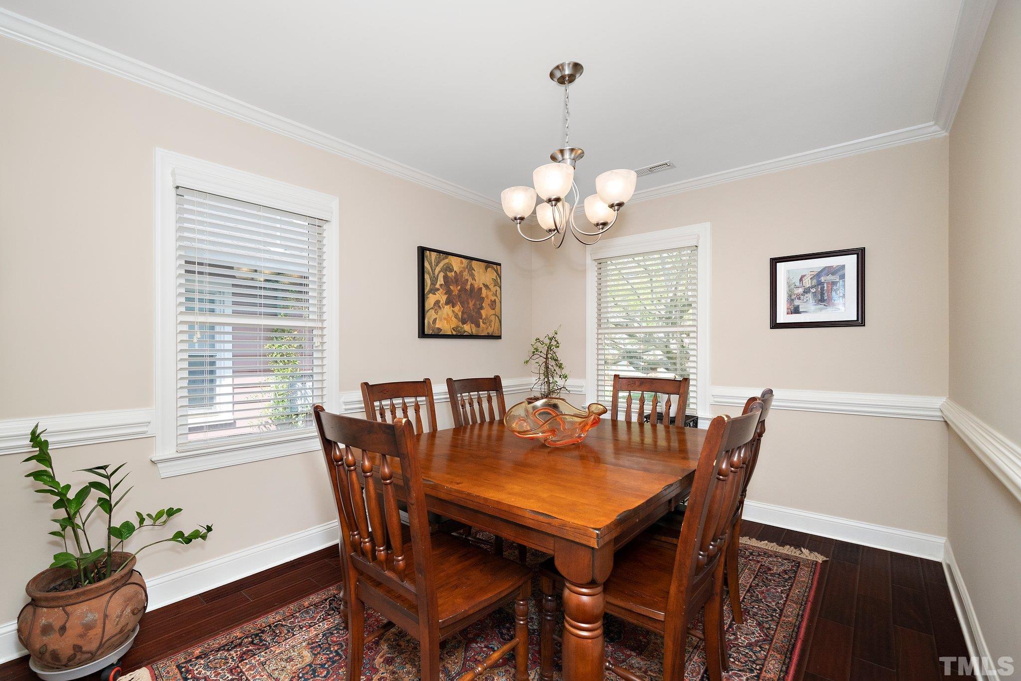606 North Boundary Street Raleigh, NC 27604 - Photo 6 of 16 a view of a dining room with furniture window and wooden floor