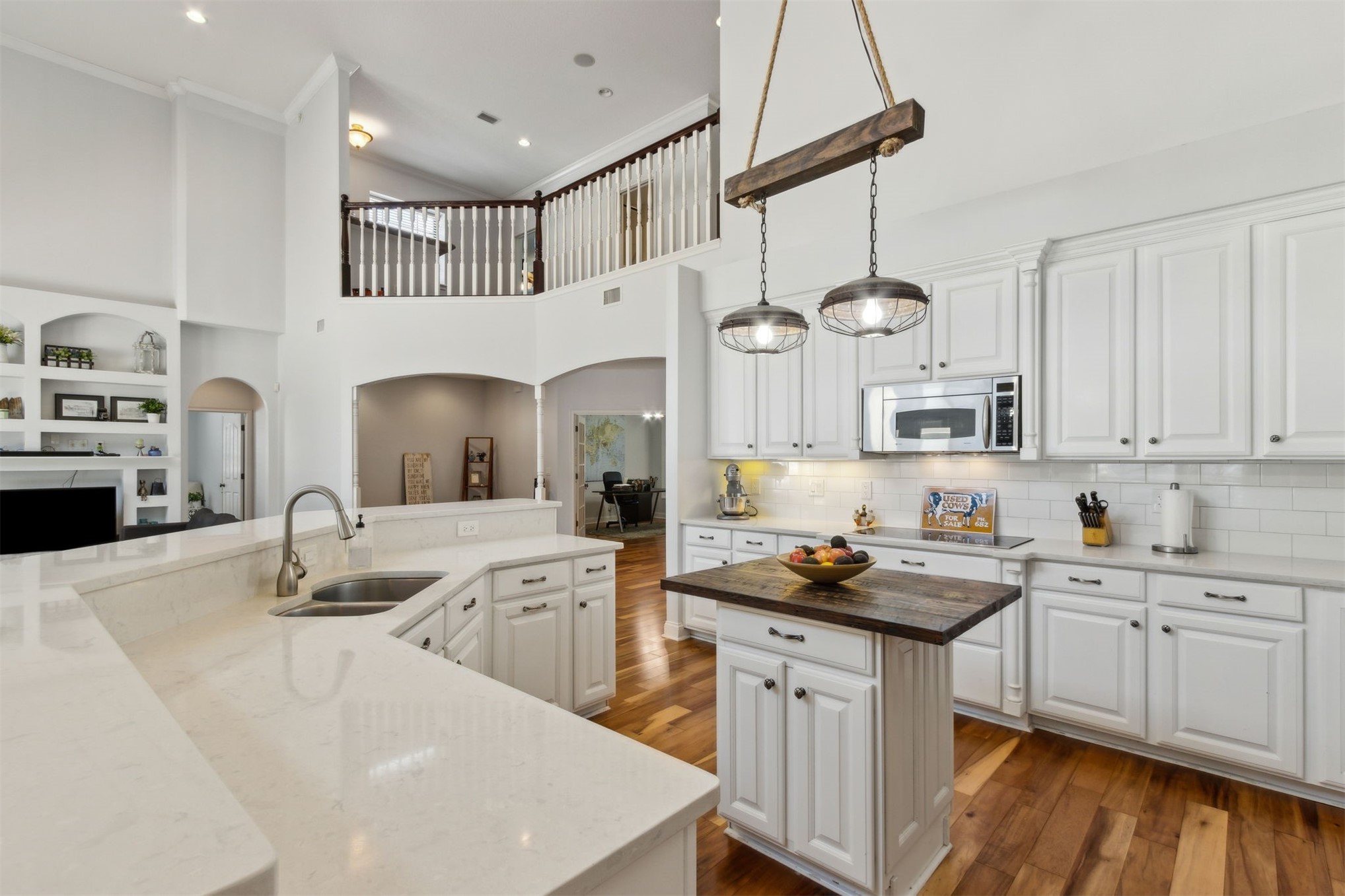 87377 Raddin Road Yulee, FL 32097 - Photo 30 of 75 a kitchen with stainless steel appliances a sink stove and cabinets