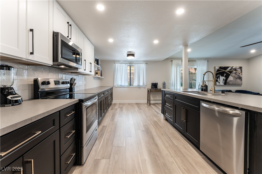 Undisclosed Address Las Vegas, NV 89119 - Photo 4 of 11 Kitchen with appliances with stainless steel finis
