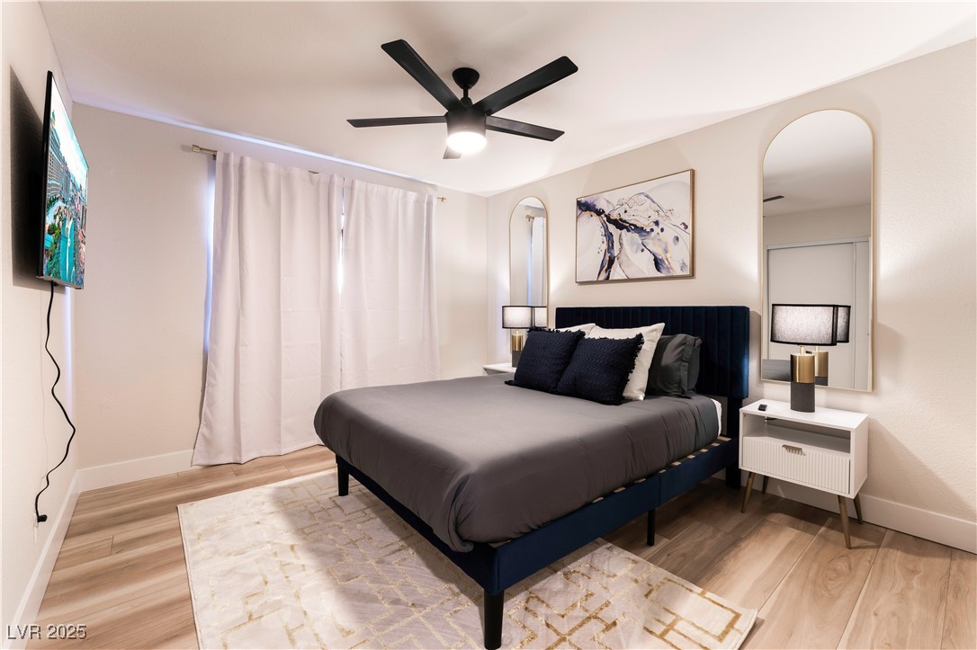 Undisclosed Address Las Vegas, NV 89119 - Photo 7 of 11 Bedroom featuring light wood-style flooring and a