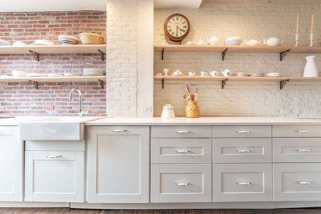 a bathroom with a sink a vanity and a large mirror