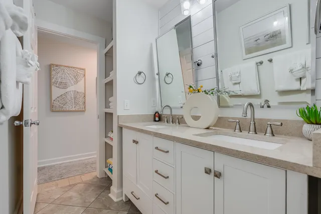 a spacious bathroom with a granite countertop sink mirror and double