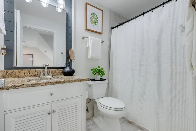 a bedroom with a bed and a table