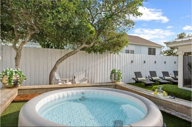 a view of a chair and tables in patio of the house