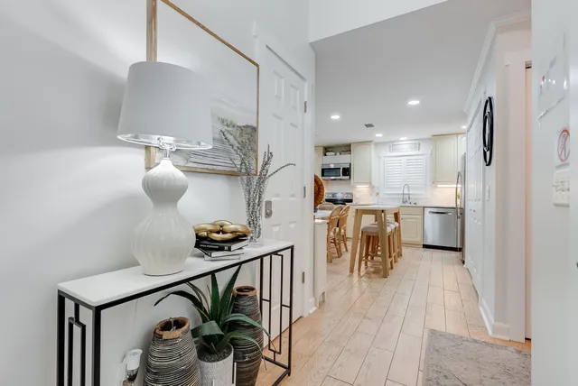 a kitchen with stainless steel appliances granite countertop a sink and a refrigerator