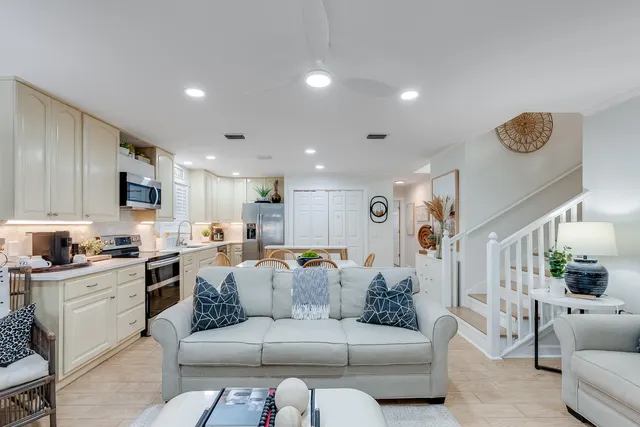 a view of a living room kitchen and a wooden floor