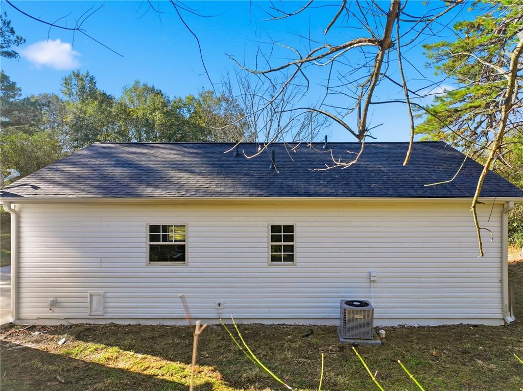 6964 Wheeler Road Lula, GA 30554 - Photo 22 of 27 a side view of a house with a yard