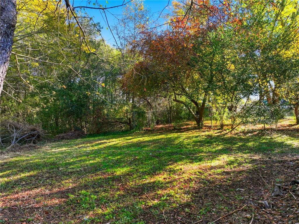 6964 Wheeler Road Lula, GA 30554 - Photo 24 of 27 a view of outdoor space with deck and yard
