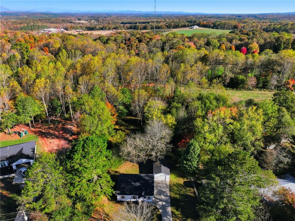 6964 Wheeler Road Lula, GA 30554 - Photo 27 of 27 an aerial view of a houses with a yard