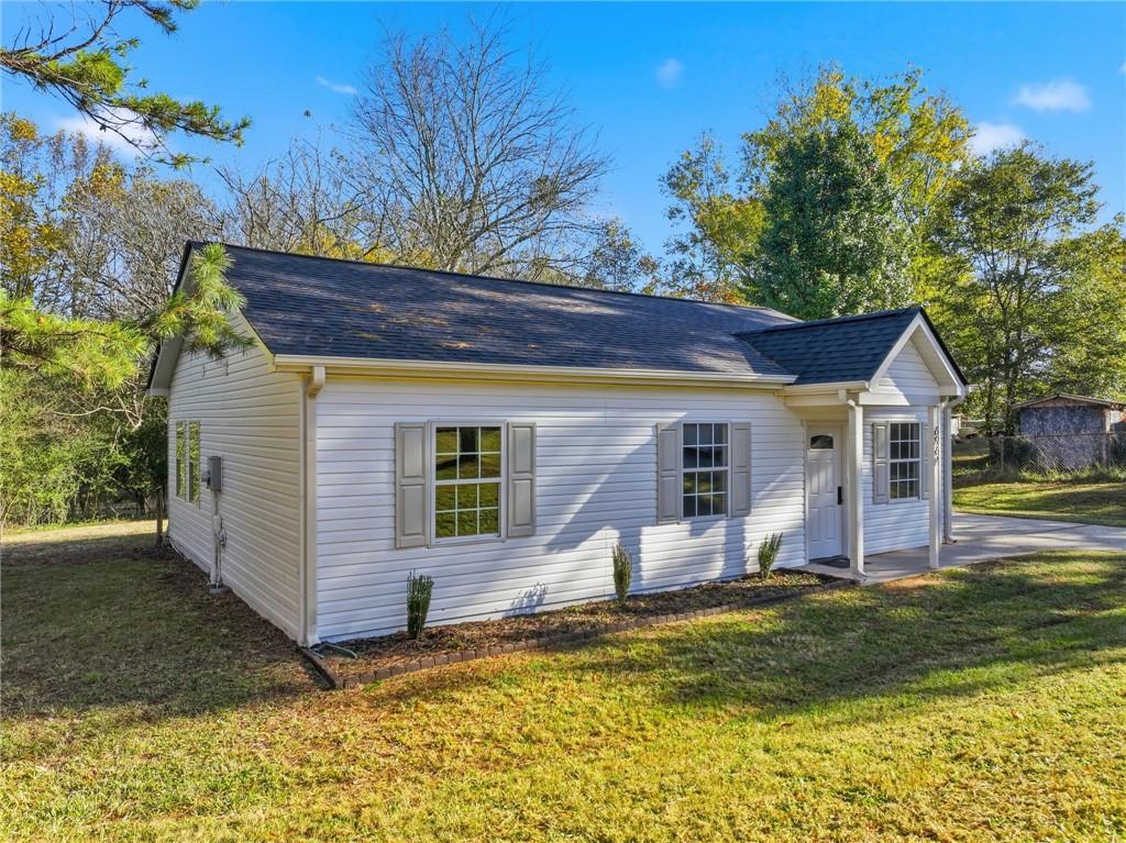 6964 Wheeler Road Lula, GA 30554 - Photo 4 of 27 a view of a house with a patio