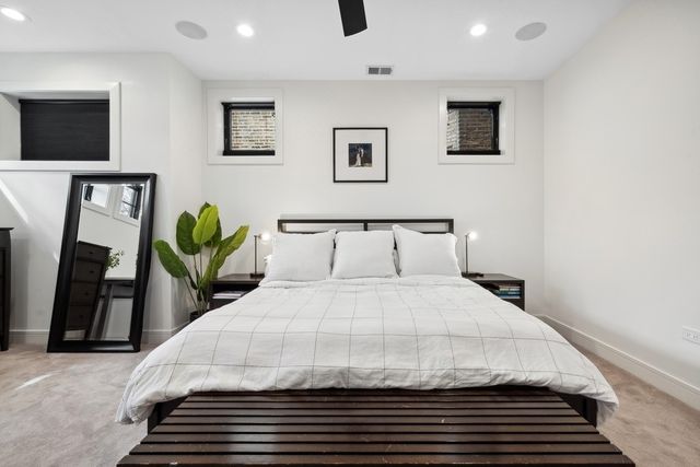 a spacious bathroom with a double vanity sink and a mirror
