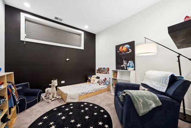 a bathroom with a double vanity sink toilet and a mirror