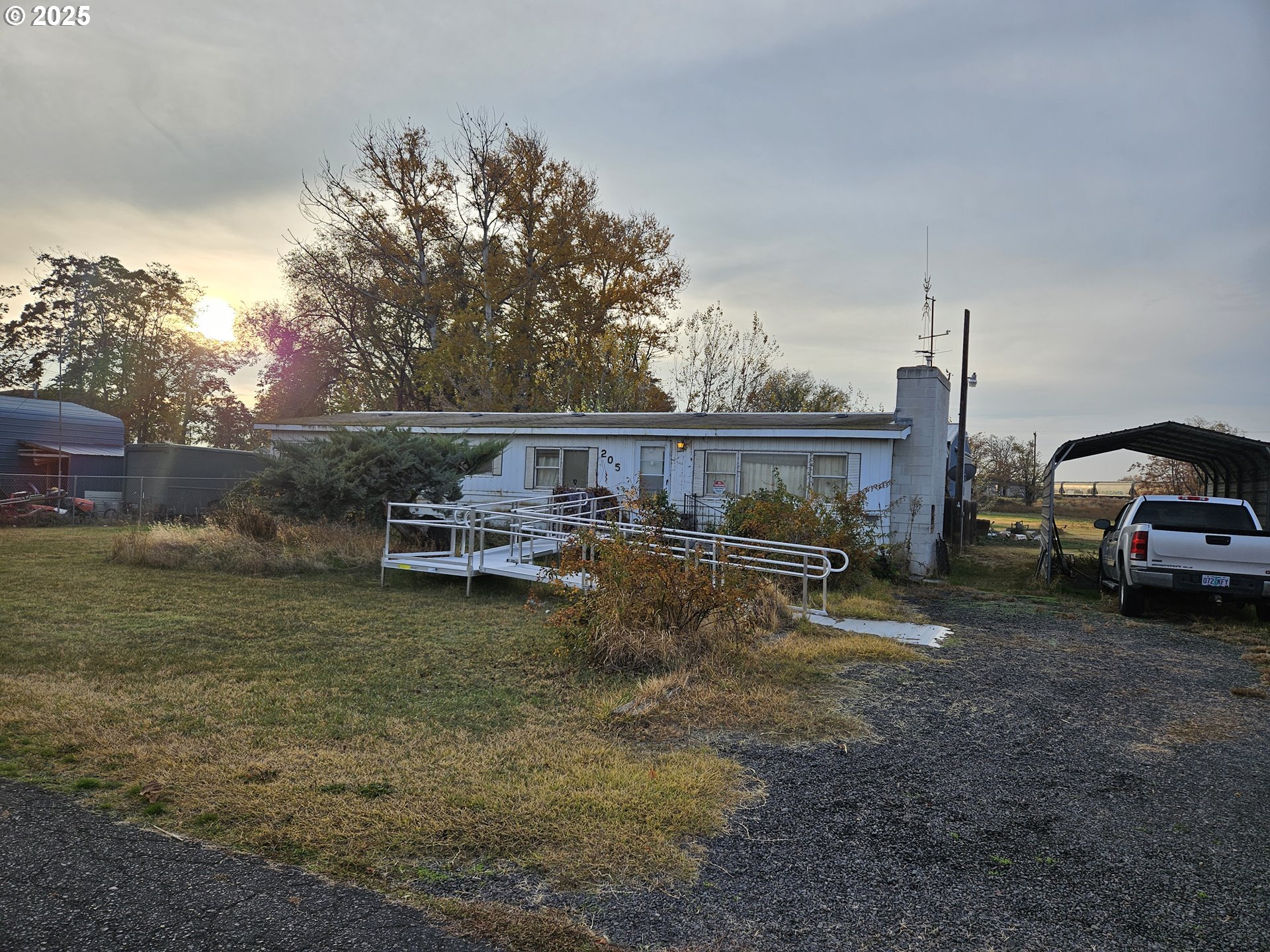 205 Southwest Page Avenue Stanfield, OR 97875 - Photo 2 of 3 a view of a house with backyard and sitting area