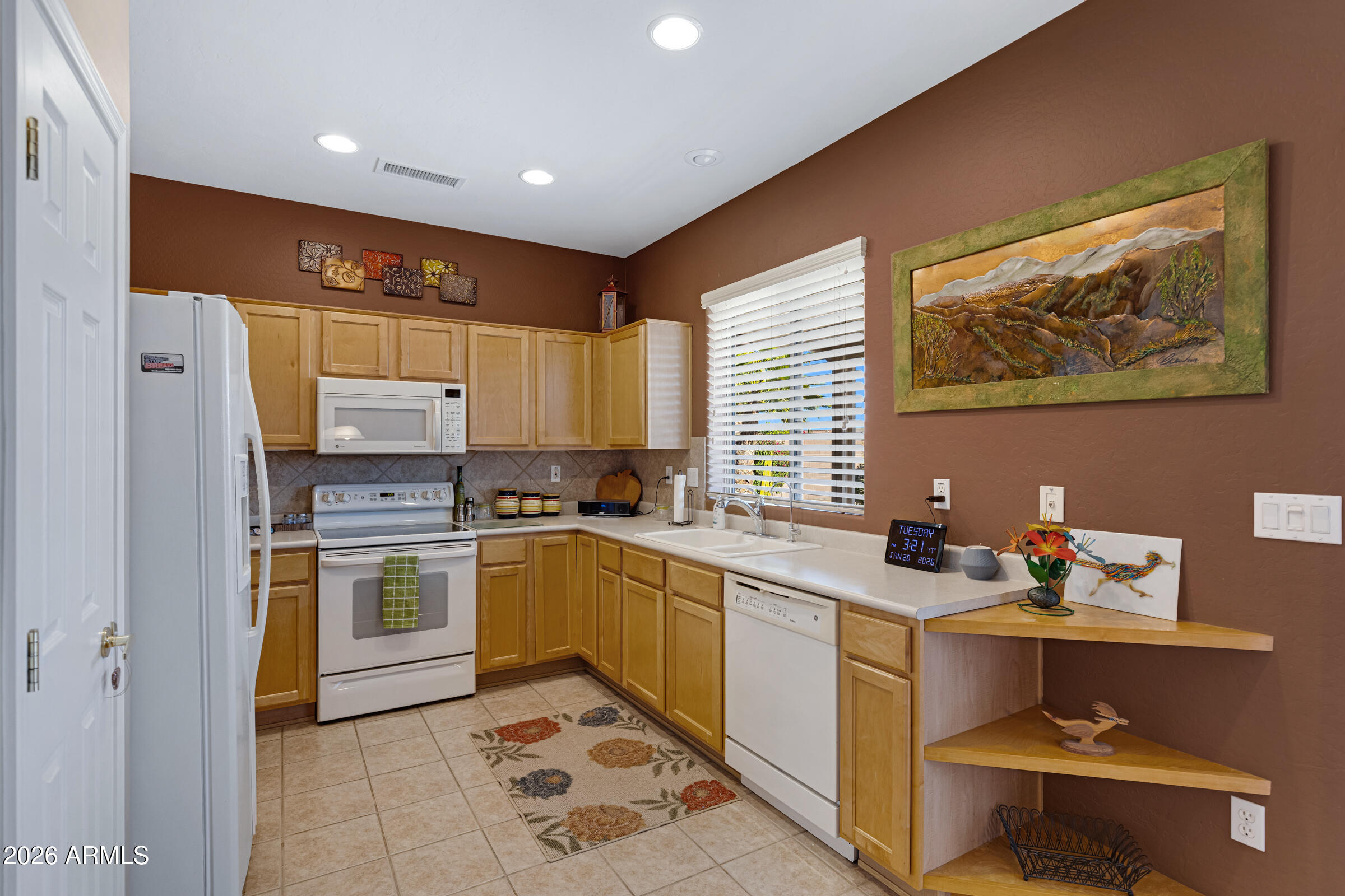 19253 North Hunters Run Surprise, AZ 85387 - Photo 11 of 30 a kitchen with a sink appliances and cabinets