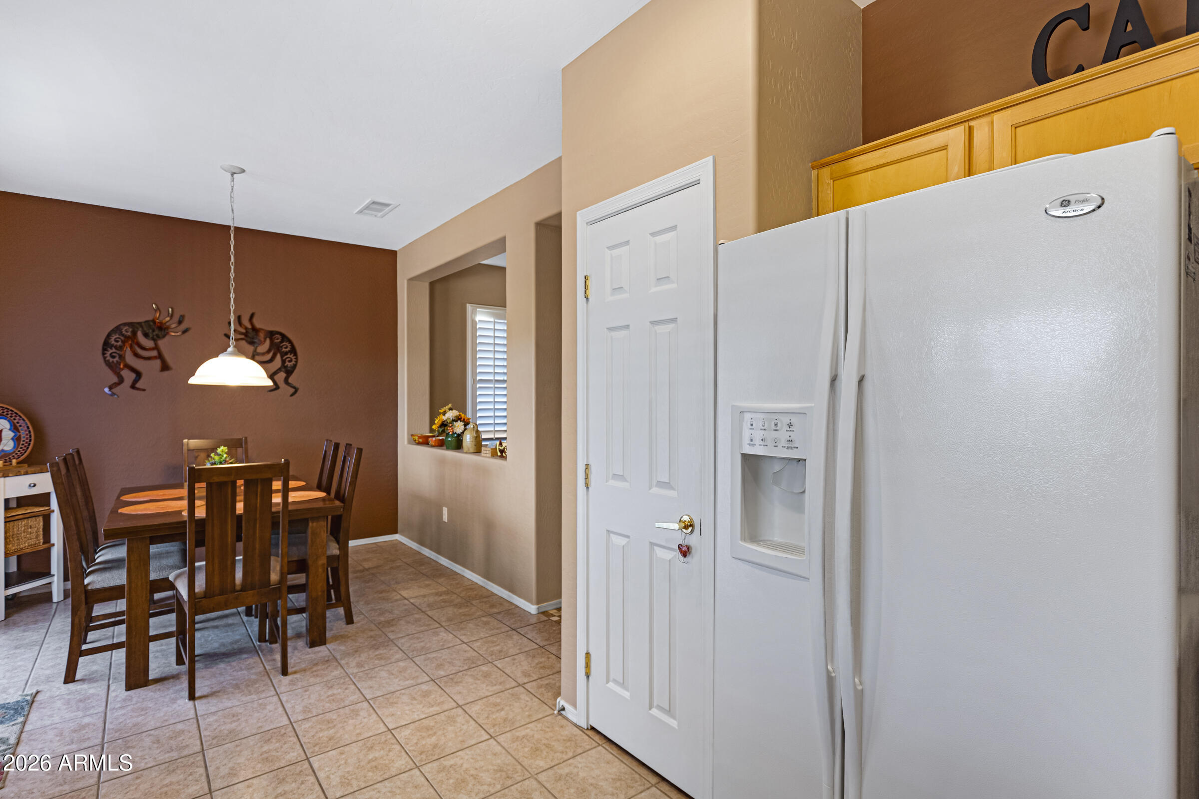 19253 North Hunters Run Surprise, AZ 85387 - Photo 14 of 30 a view of dining room with furniture and chandelier