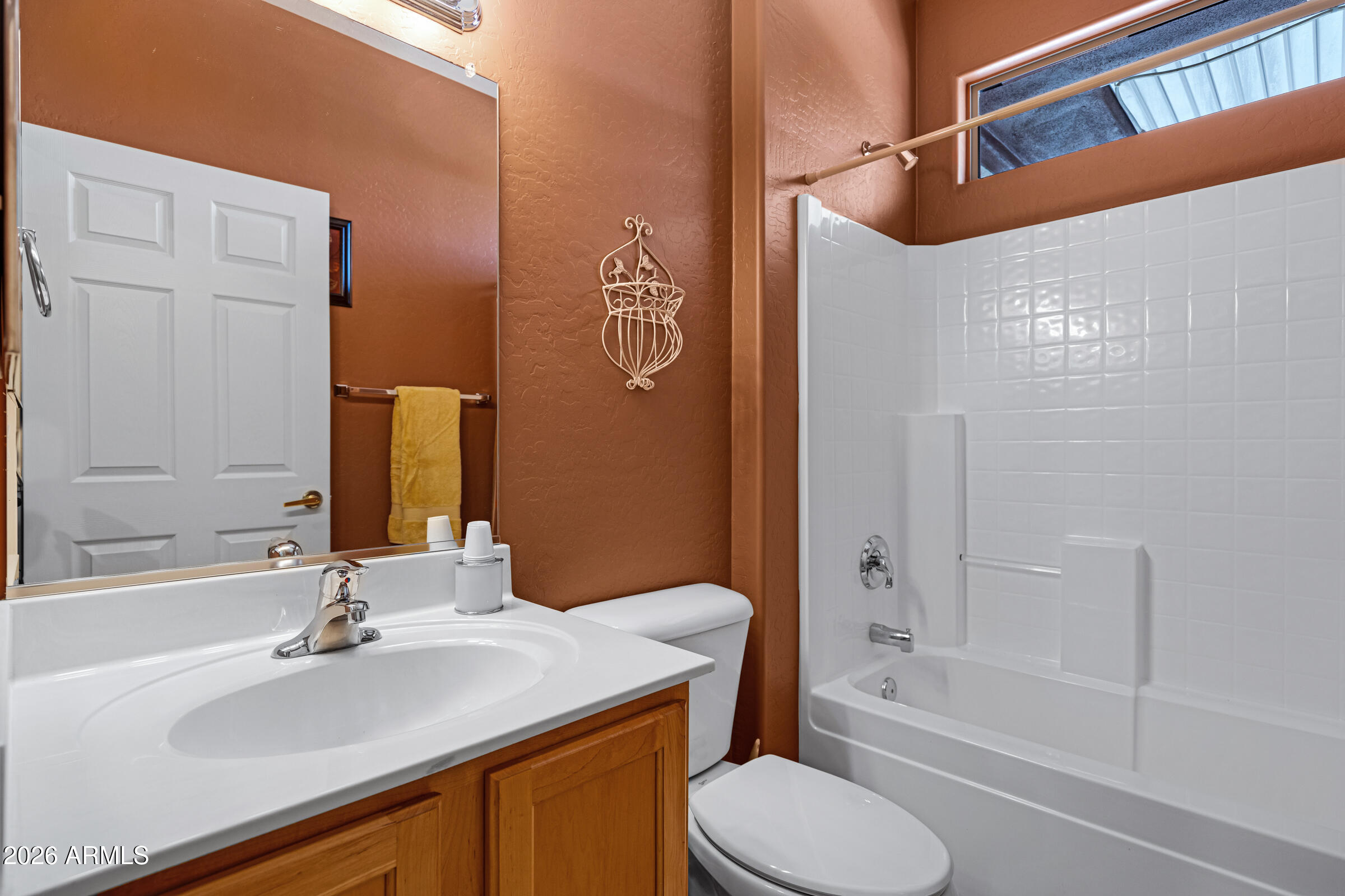 19253 North Hunters Run Surprise, AZ 85387 - Photo 17 of 30 a bathroom with a sink toilet and shower