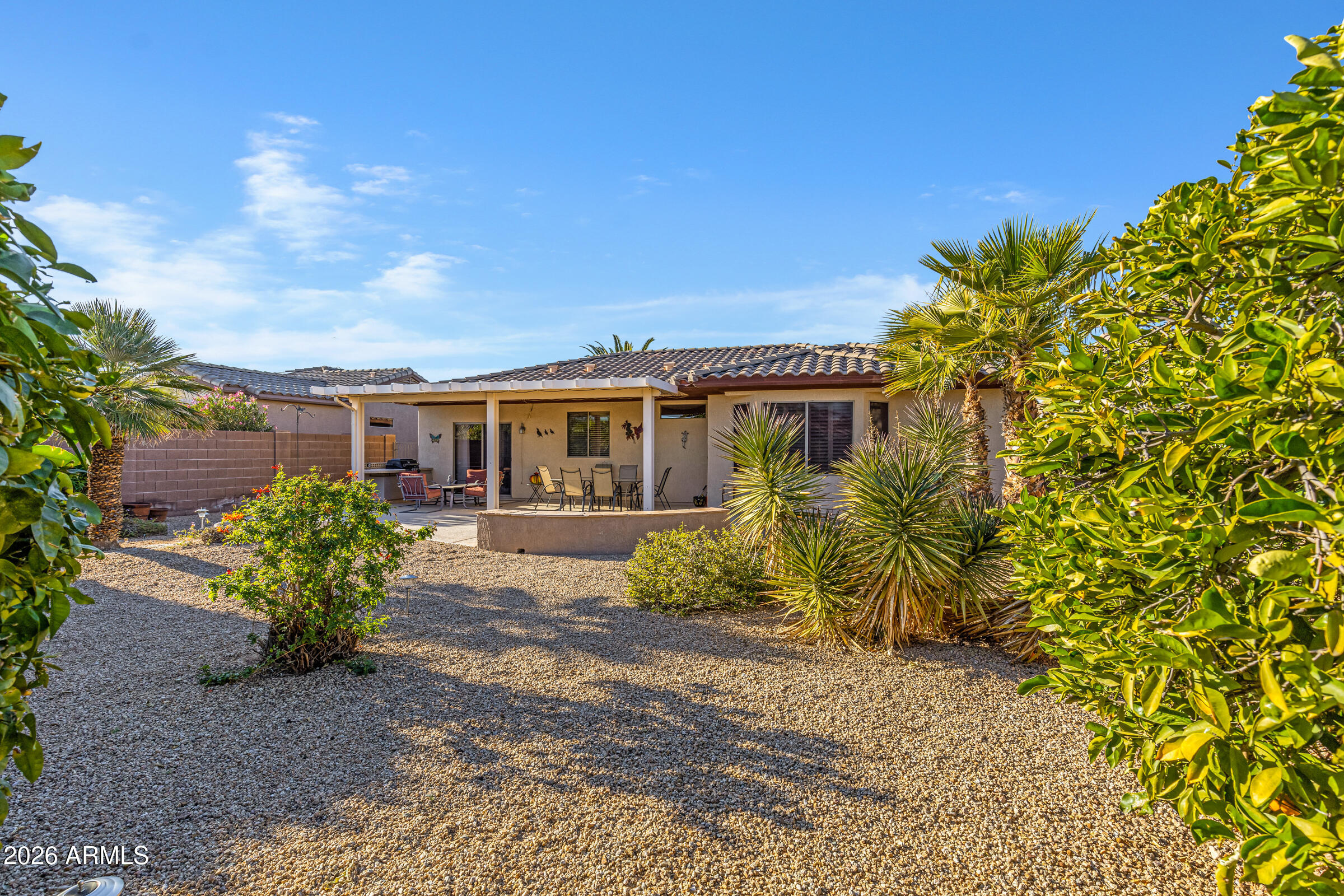 19253 North Hunters Run Surprise, AZ 85387 - Photo 24 of 30 a view of a house with a garden