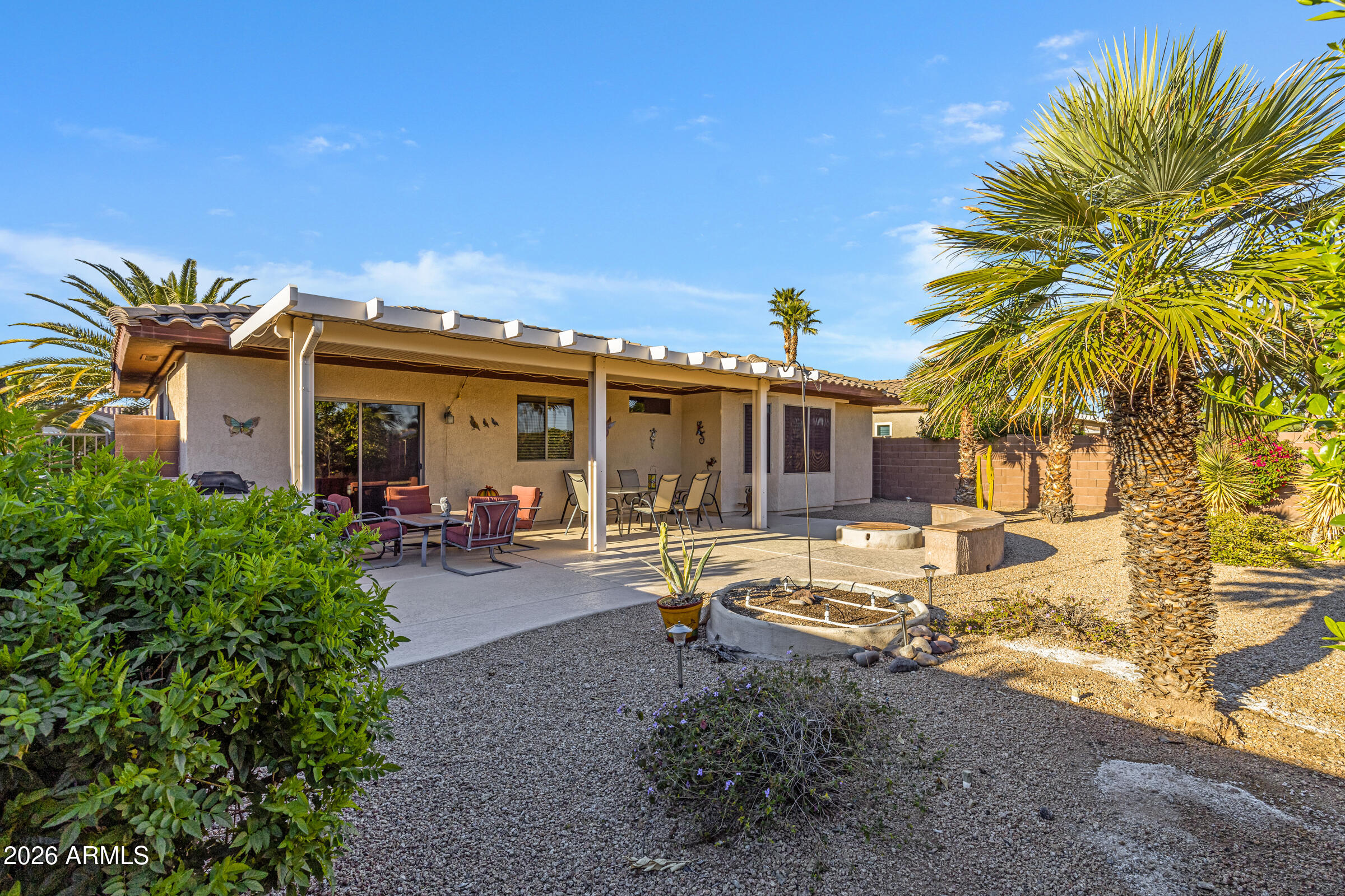 19253 North Hunters Run Surprise, AZ 85387 - Photo 25 of 30 a view of a house with backyard and sitting area