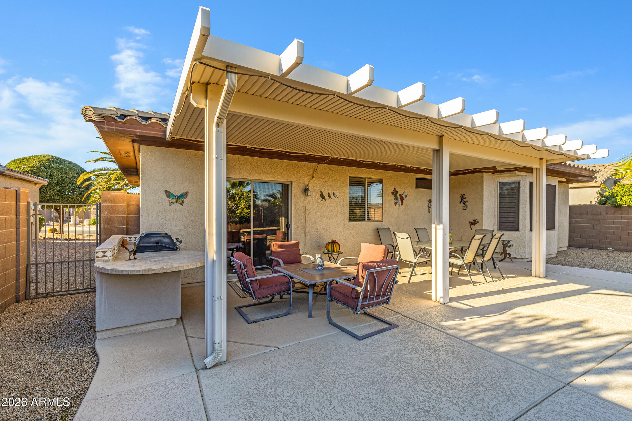 19253 North Hunters Run Surprise, AZ 85387 - Photo 26 of 30 a view of a patio with table and chairs