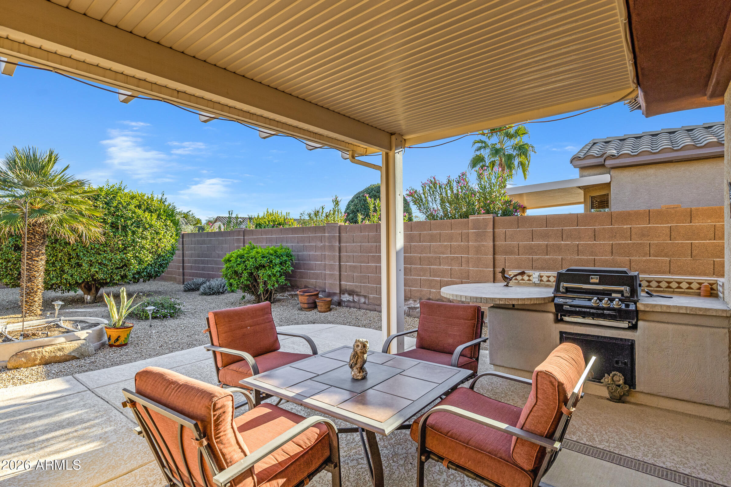 19253 North Hunters Run Surprise, AZ 85387 - Photo 27 of 30 a backyard of a house with outdoor seating
