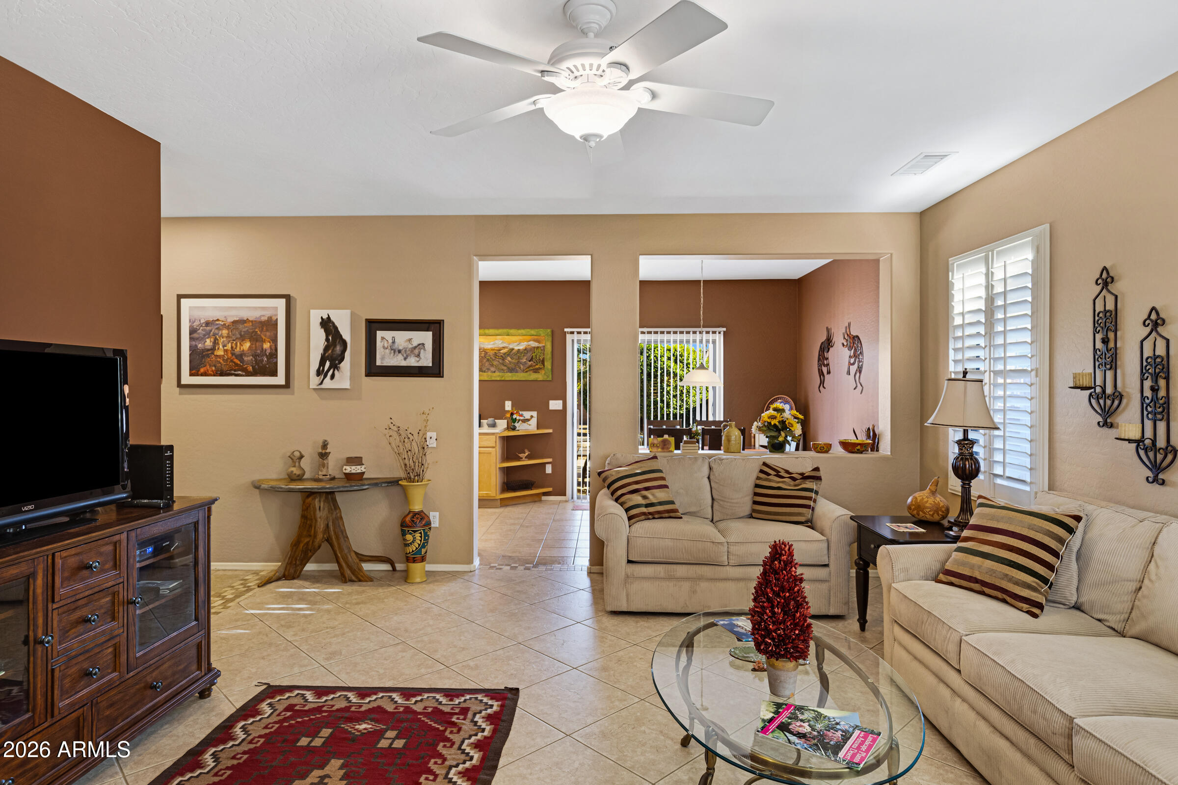 19253 North Hunters Run Surprise, AZ 85387 - Photo 7 of 30 a living room with furniture and a flat screen tv