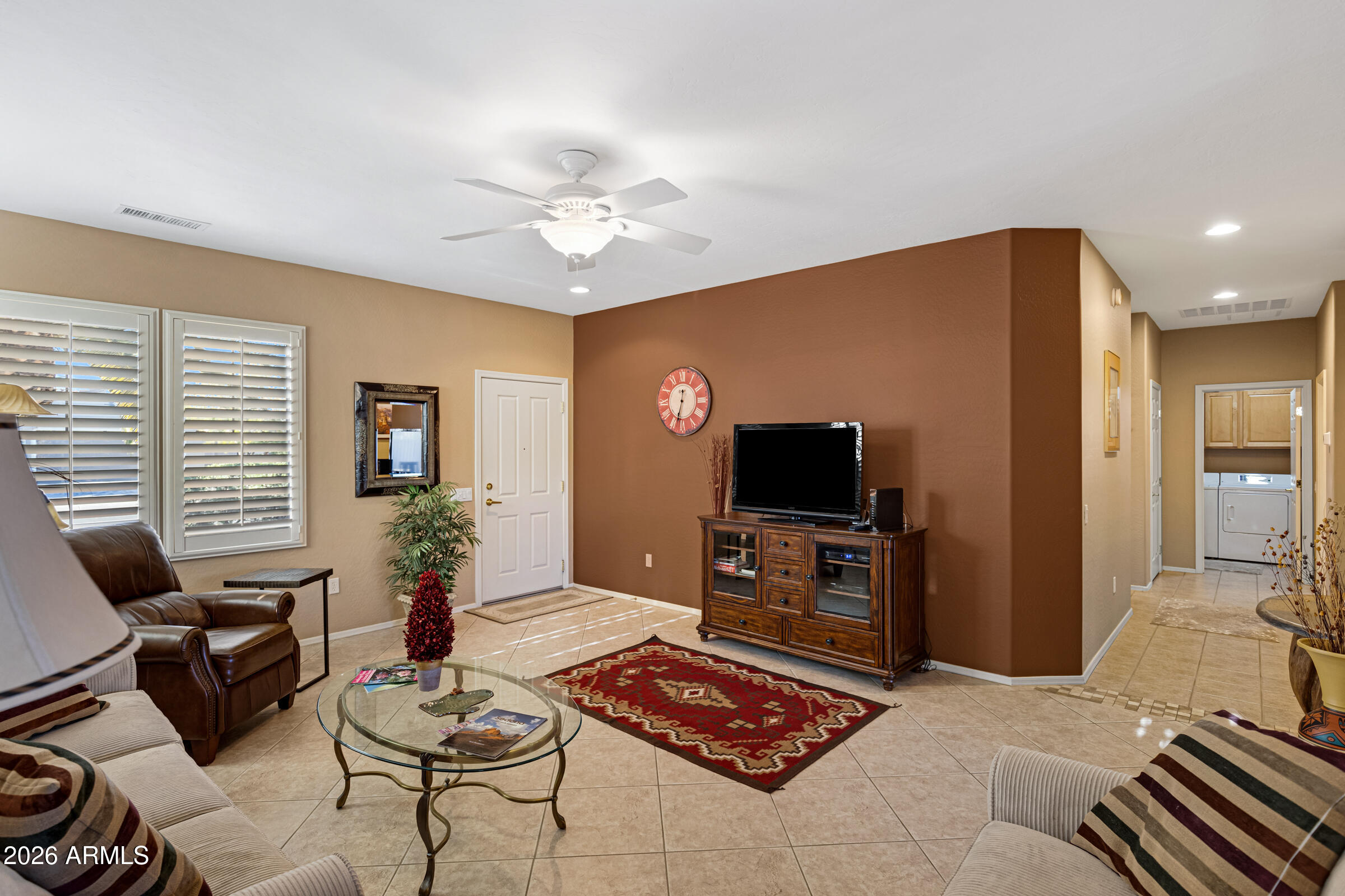 19253 North Hunters Run Surprise, AZ 85387 - Photo 8 of 30 a living room with furniture and a flat screen tv