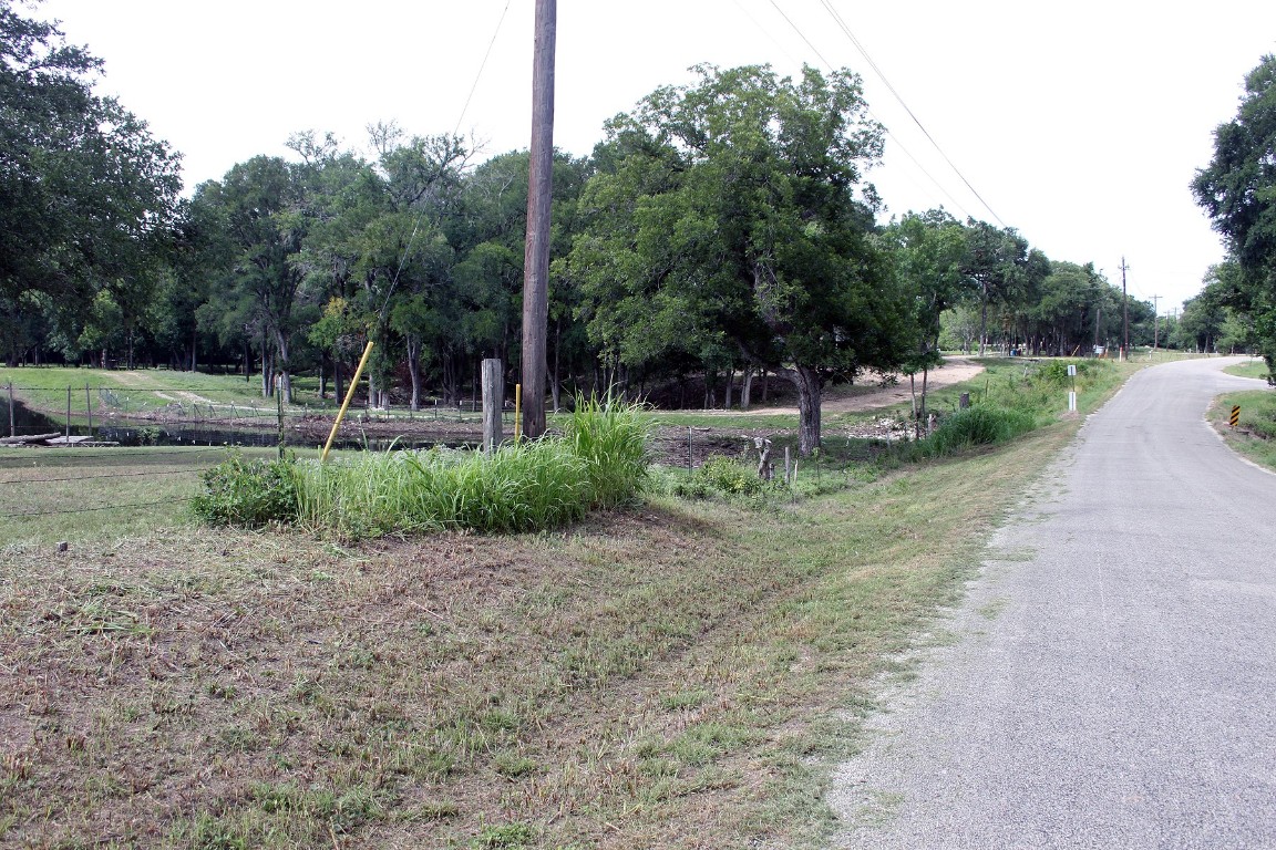 1000 Old Lytton Springs Road Lockhart, TX 78644 - Photo 10 of 22 a backyard of a house with yard and trampoline