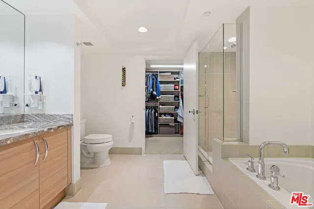 a balcony with table and chairs