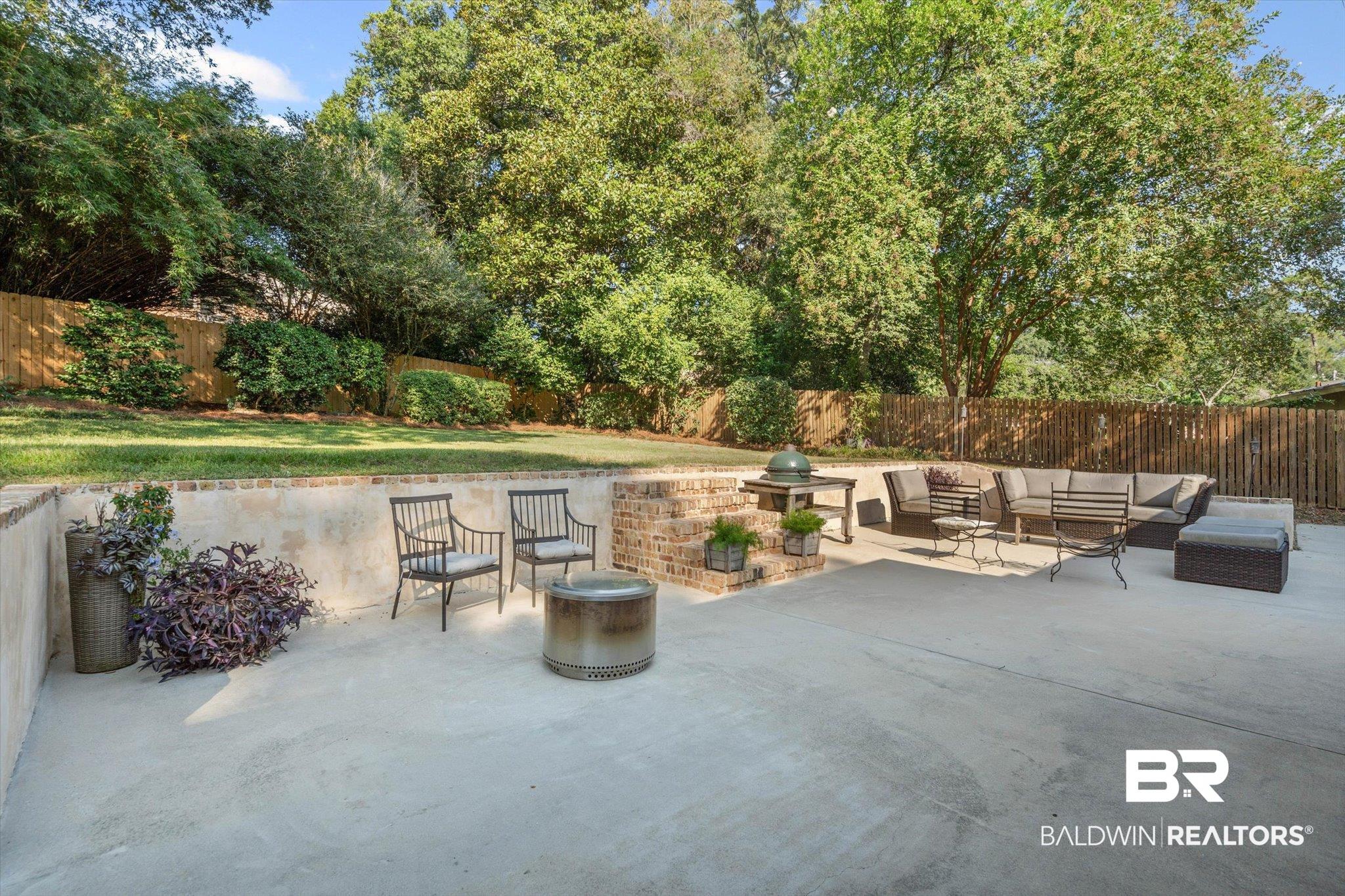 313 Brawood Drive Mobile, AL 36608 - Photo 25 of 32 Fenced backyard featuring an outdoor hangout area and a patio area