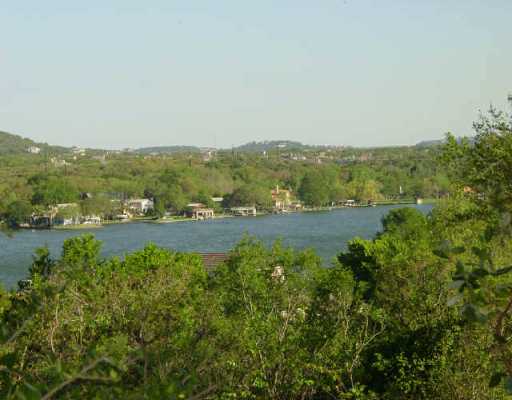 a view of a town with mountains in the background