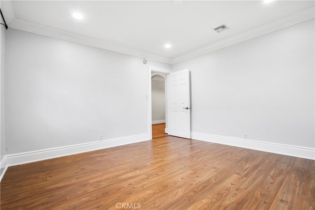 14934 Dickens Street, Unit 15 Sherman Oaks, CA 91403 - Photo 11 of 15 a view of an empty room with wooden floor