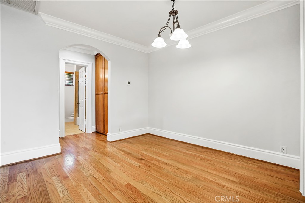 14934 Dickens Street, Unit 15 Sherman Oaks, CA 91403 - Photo 8 of 15 wooden floor in an empty room