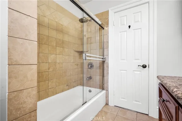a bathroom with a tub a sink and a shower