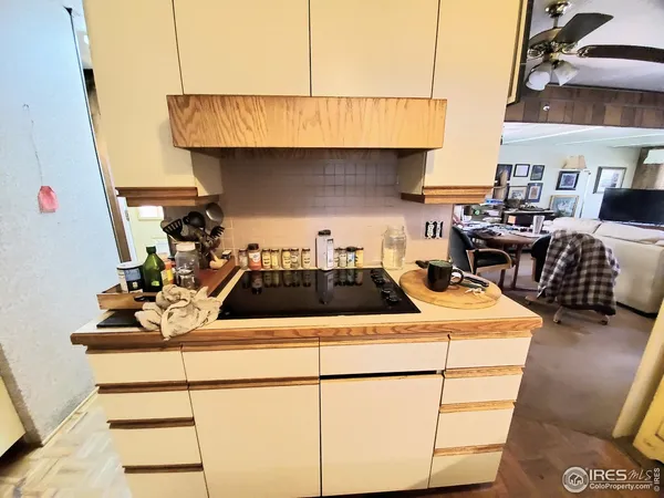 a kitchen with kitchen island a stove a sink and a refrigerator