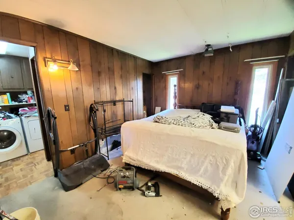 a room with gym equipment and a mirror