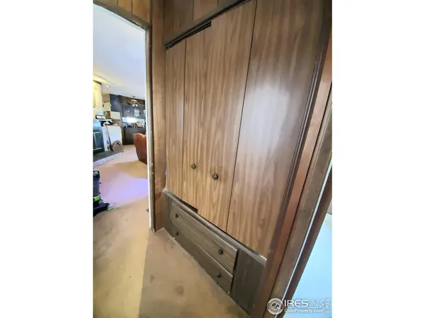a view of a hallway with a room