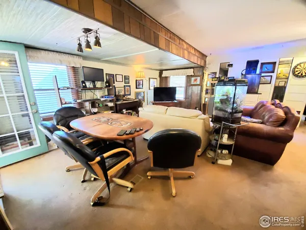 a room with furniture and a chandelier