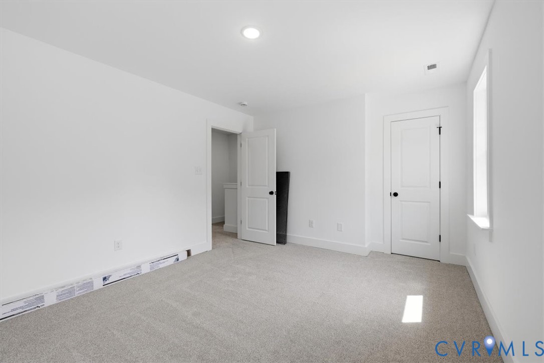 654 Frenchs Store Road Cumberland, VA 23040 - Photo 14 of 24 Neutral-toned carpeting complements the white wall