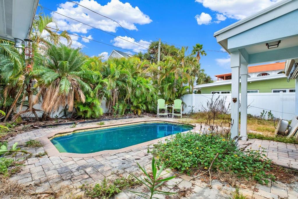 16218 1st Street East Redington Beach, FL 33708 - Photo 15 of 20 a view of a swimming pool with a patio