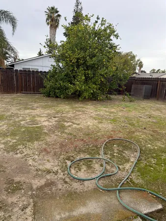 a view of a room with wooden floor and windows