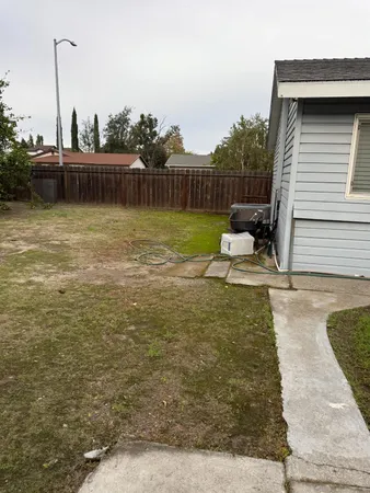 a house view with a garden space