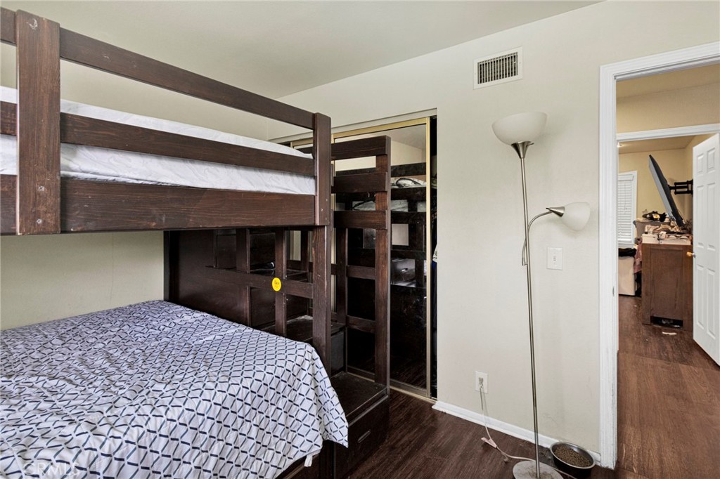 1087 Baseline Road La Verne, CA 91750 - Photo 30 of 39 a bedroom with a bed and a dresser