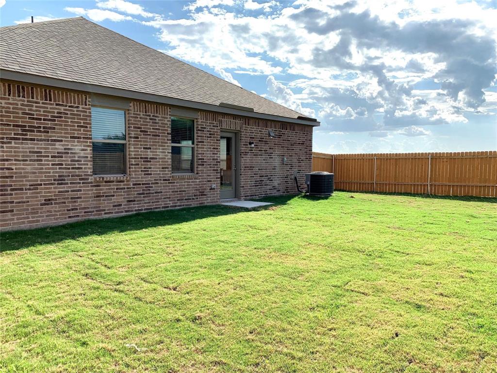 144 Emma Drive Anna, TX 75409 - Photo 32 of 34 a backyard of a house with lots of green space