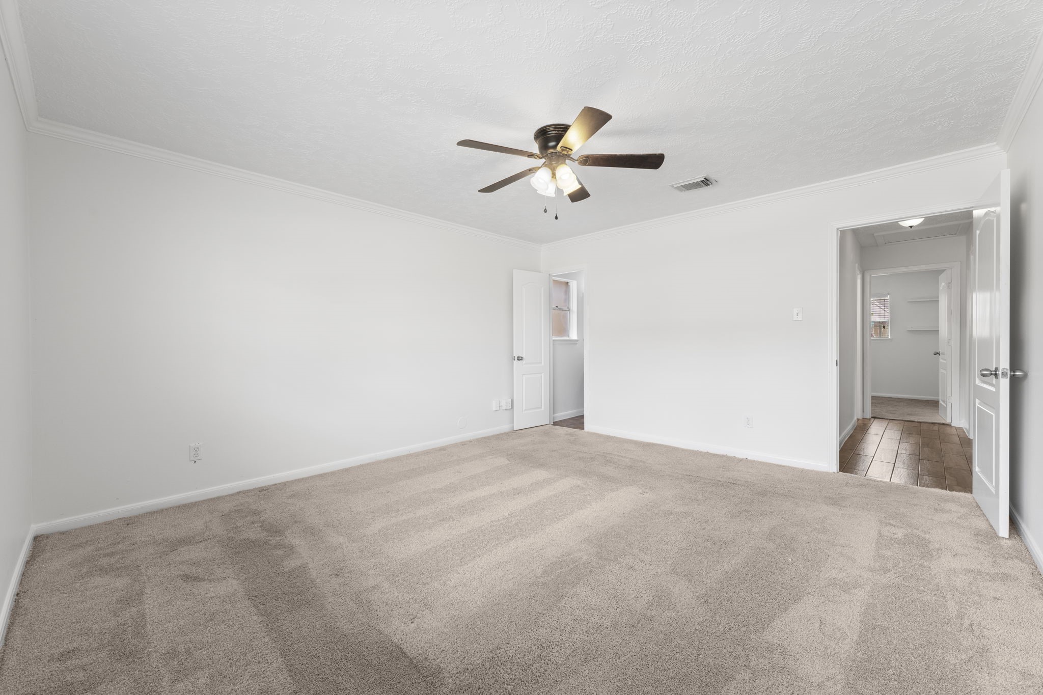 9735 Kemp Forest Drive Houston, TX 77080 - Photo 15 of 25 Primary bedroom includes ceiling fan.