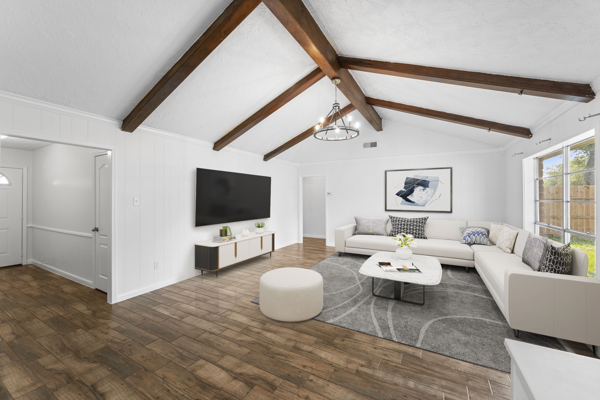 9735 Kemp Forest Drive Houston, TX 77080 - Photo 6 of 25 Family Room with Beamed Ceiling Treatment and Cathedral Vault. *Virtually Staged