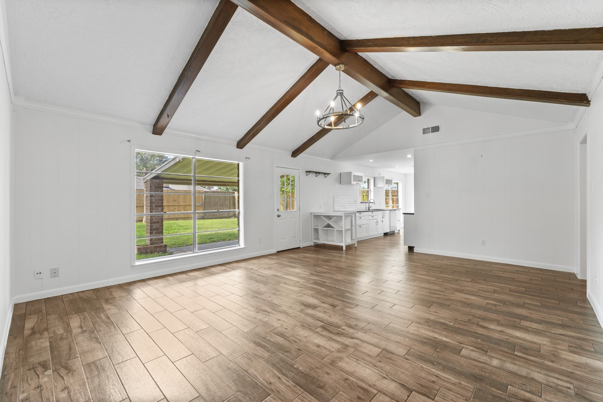 9735 Kemp Forest Drive Houston, TX 77080 - Photo 7 of 25 Durable and low maintenance wood-look tile throughout.