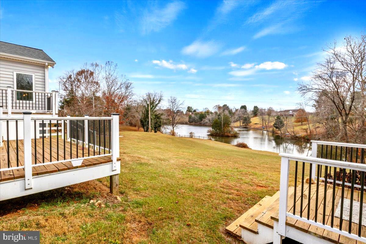 65 Chestnut Rail Lane Madison, VA 22727 - Photo 31 of 50 a view of a swimming pool with a lounge chair