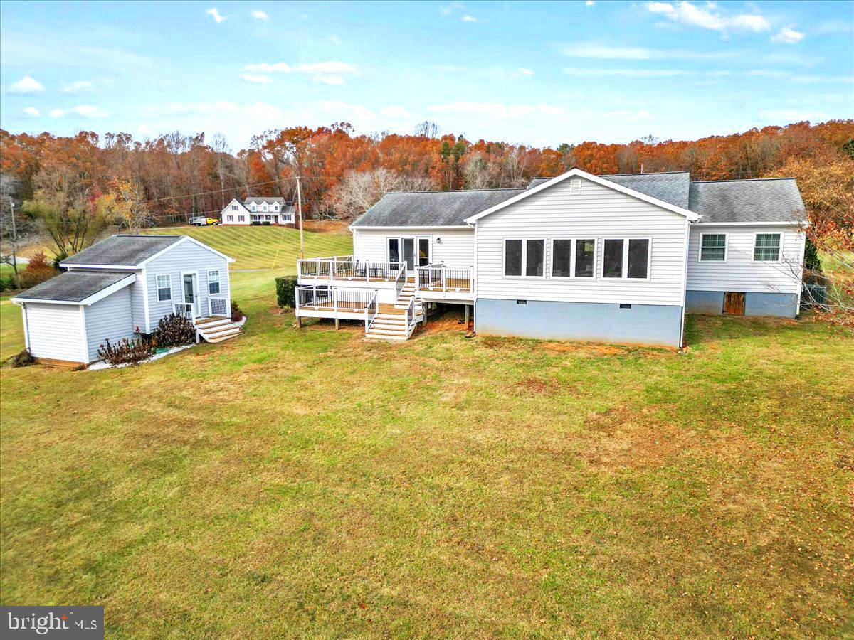 65 Chestnut Rail Lane Madison, VA 22727 - Photo 34 of 50 a front view of a house with a big yard and large tree