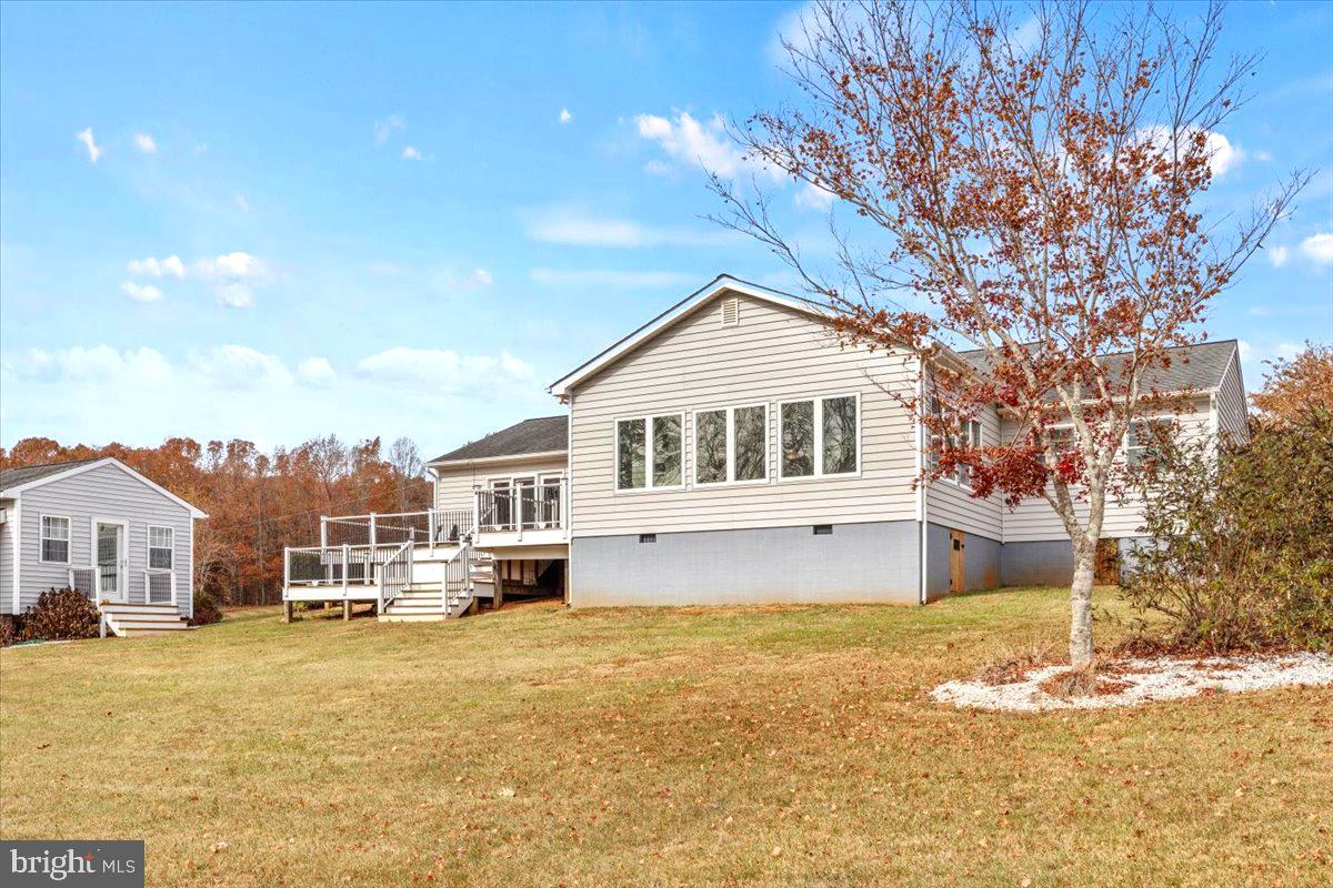 65 Chestnut Rail Lane Madison, VA 22727 - Photo 35 of 50 a front view of a house with a yard covered with snow and trees