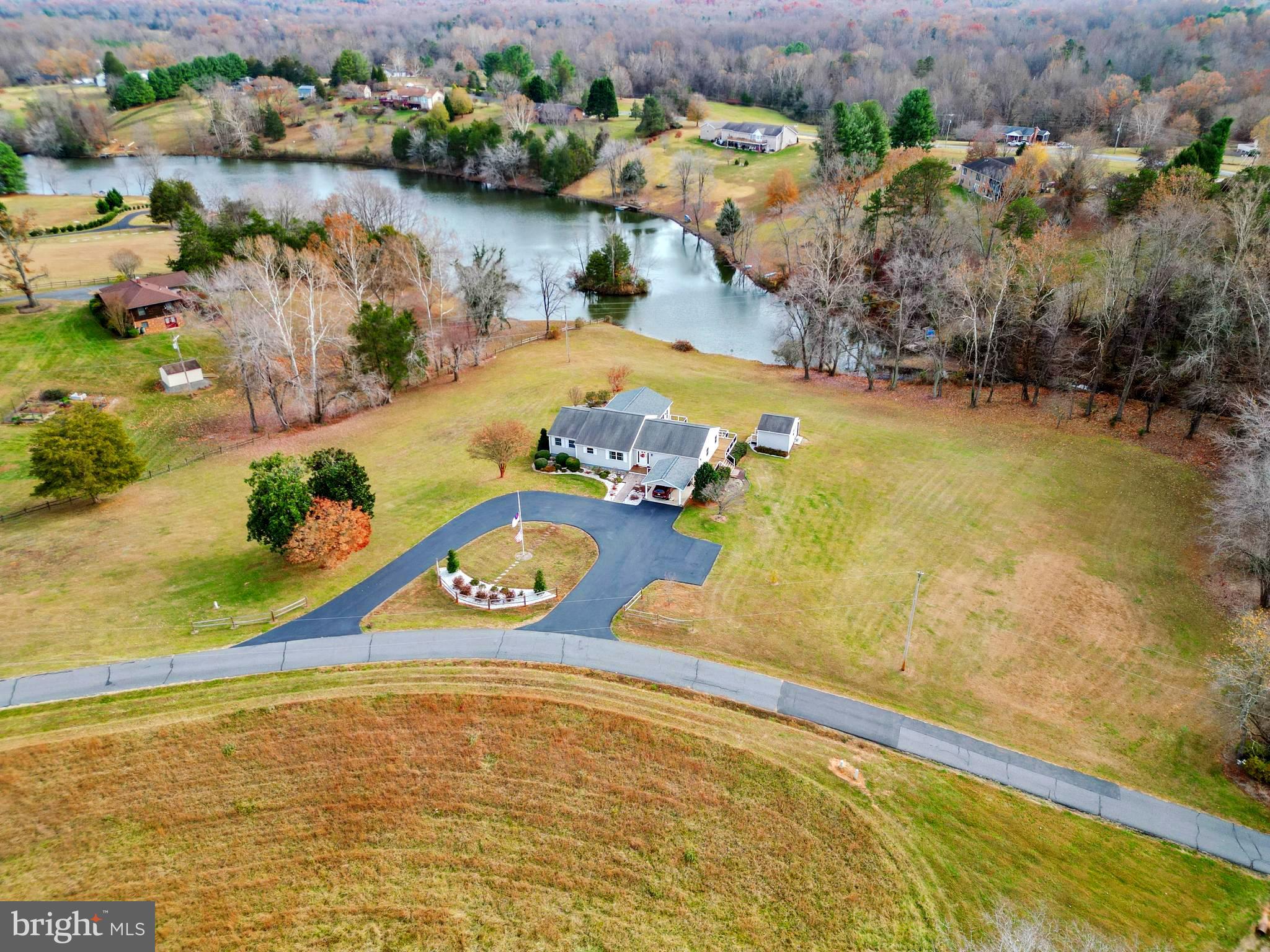 65 Chestnut Rail Lane Madison, VA 22727 - Photo 48 of 50 an aerial view of a house with a lake view